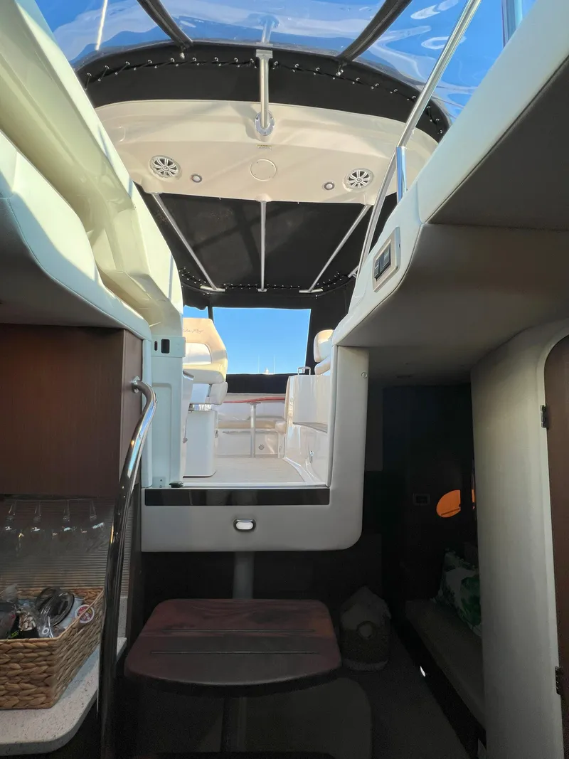Slide: The Image of Interior view of 2014 Sea Ray 350 Sundancer yacht, showcasing cabin and seating area. - 46