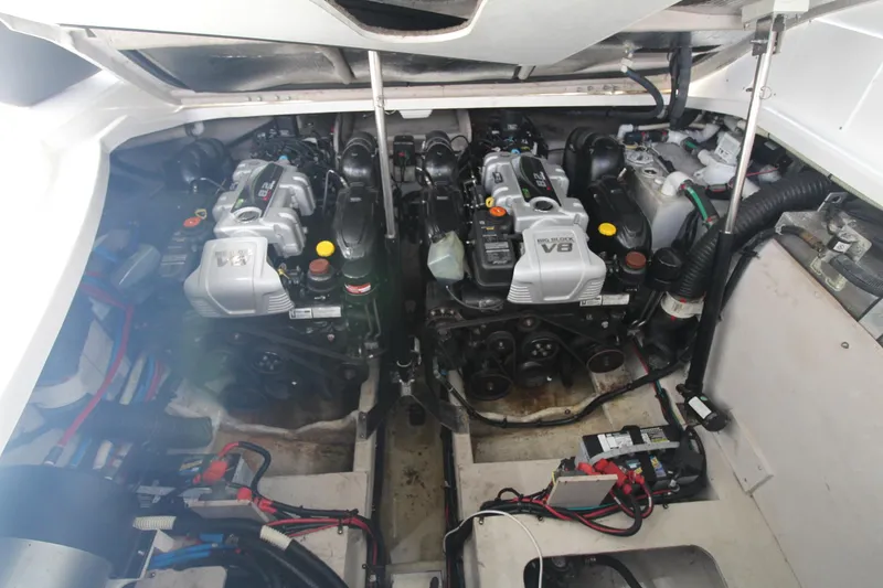 Slide: The Image of Engine compartment of 2014 Sea Ray 350 Sundancer with dual V8 engines. - 47