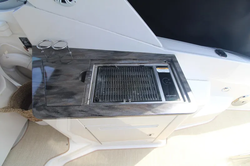 Slide: The Image of Outdoor grill on 2014 Sea Ray 350 Sundancer yacht, featuring sleek countertop design. - 49