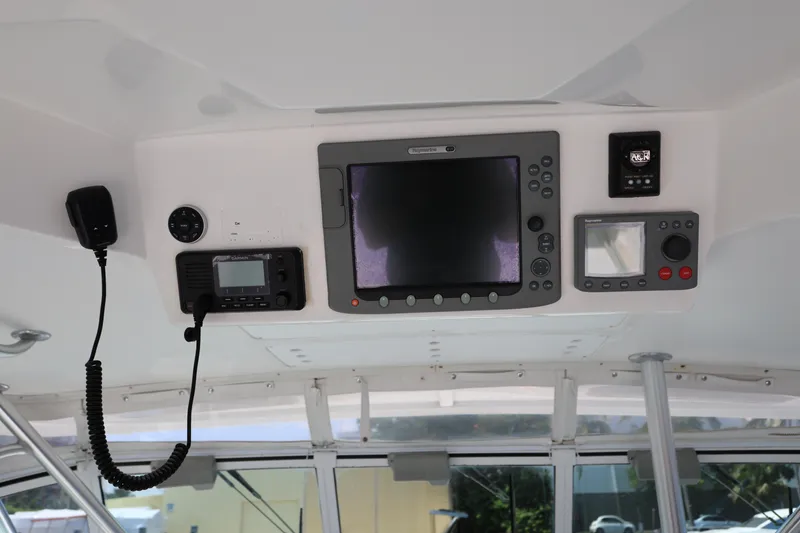 Slide: The Image of 2007 Luhrs 32 Open helm electronics and navigation equipment. - 16