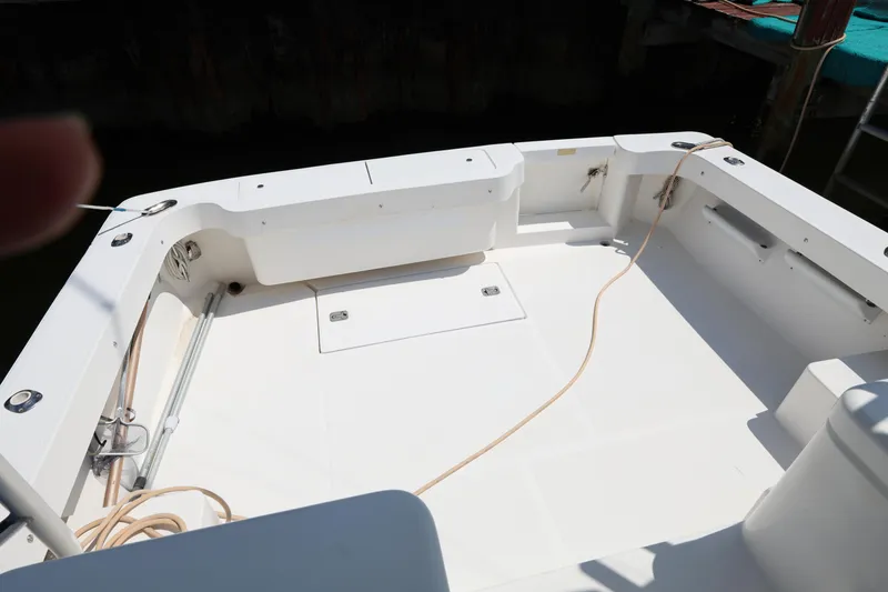 Slide: The Image of 2007 Luhrs 32 Open boat deck with storage compartments and clean white surface. - 19