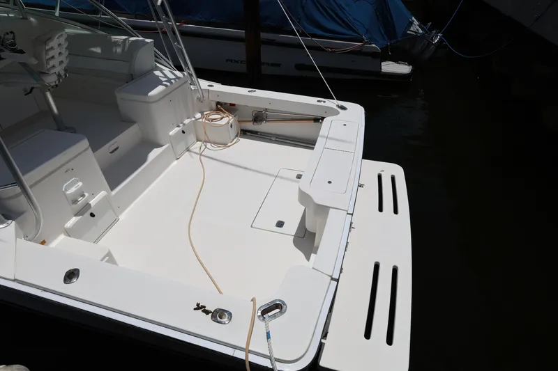 Slide: The Image of 2007 Luhrs 32 Open boat deck with seating and storage compartments. - 7
