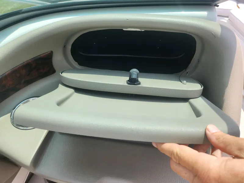 Slide: The Image of 2014 Crownline 21 SS boat dashboard storage compartment. - 12