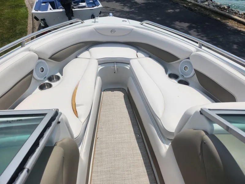 Slide: The Image of 2014 Crownline 21 SS boat with white and beige interior seating. - 15