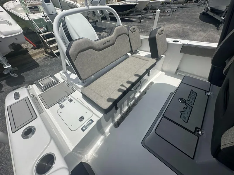 Slide: The Image of 2025 Sea Pro 245 FLX boat interior with seating and storage compartments. - 9