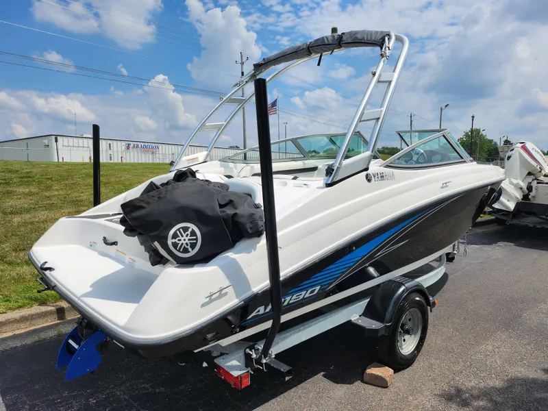Slide: The Image of 2016 Yamaha Boats AR190 on trailer, white and black, with blue accents, outdoor display. - 3