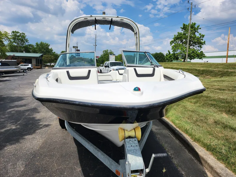 Slide: The Image of 2016 Yamaha Boats AR190 on trailer, front view, white and black, sunny day. - 6