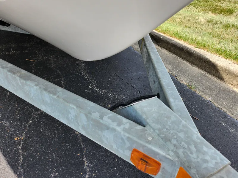 Slide: The Image of 2016 Yamaha Boats AR190 on a trailer, close-up view of the hull and trailer. - 7