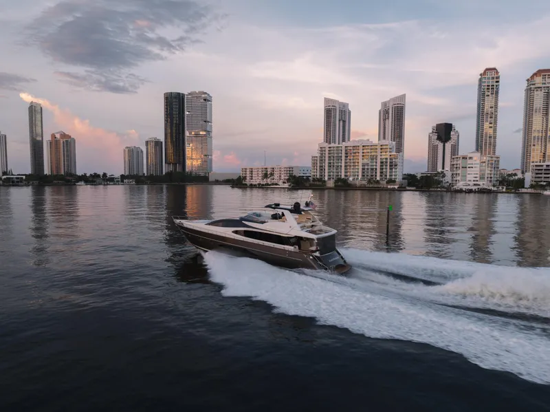 Slide: The Image of Luxury Riva 75 Venere yacht cruising near city skyline at sunset, 2012 model. - 13