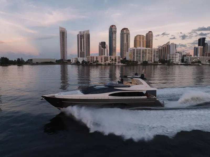 Slide: The Image of Luxury Riva 75 Venere yacht cruising near city skyline at sunset, 2012 model. - 14