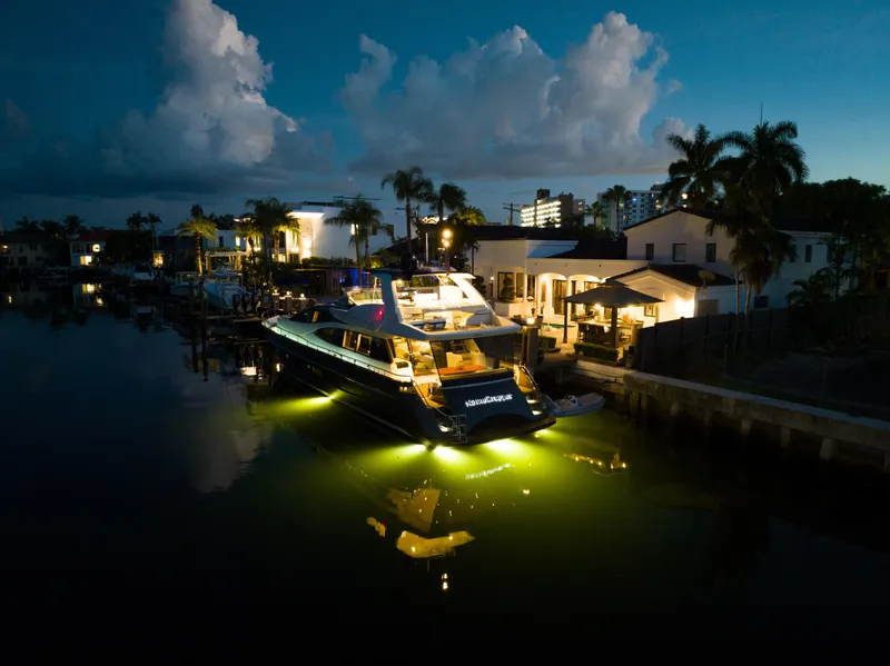 Slide: The Image of Luxury Riva 75 Venere yacht docked at night, 2012 model, illuminated with underwater lights. - 17