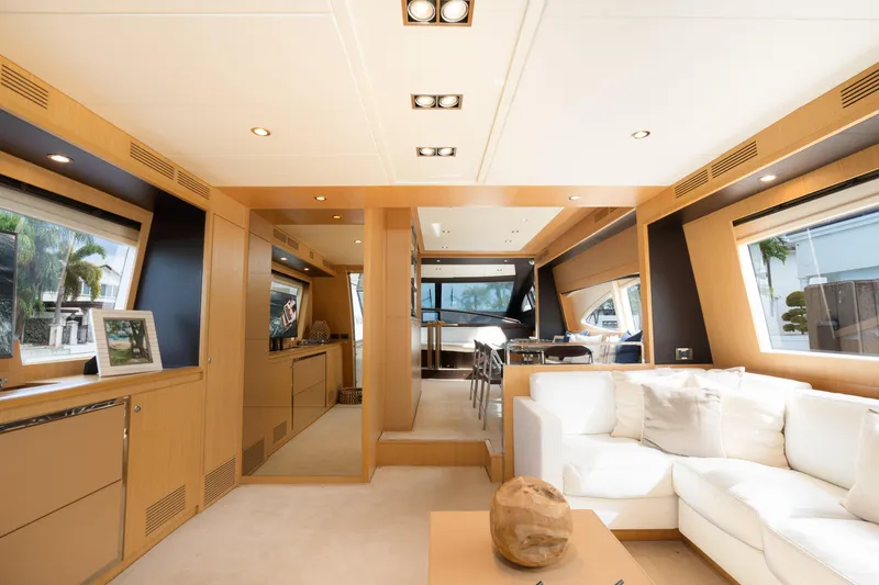 Slide: The Image of Luxurious interior of 2012 Riva 75 Venere yacht with modern furnishings and large windows. - 19