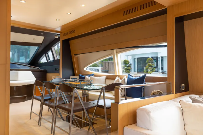 Slide: The Image of Luxurious interior of 2012 Riva 75 Venere yacht with modern dining area and large windows. - 22