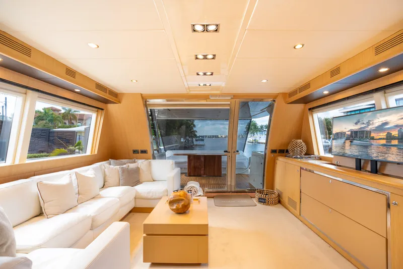Slide: The Image of Luxurious interior of 2012 Riva 75 Venere yacht with modern furnishings and large windows. - 23