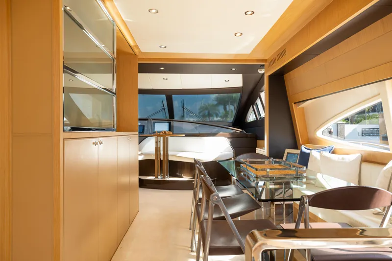 Slide: The Image of Luxurious interior of 2012 Riva 75 Venere yacht with modern dining area and large windows. - 24