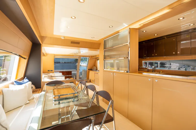 Slide: The Image of Luxurious interior of 2012 Riva 75 Venere yacht with modern dining area and kitchen. - 25
