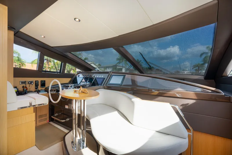 Slide: The Image of Interior helm of 2012 Riva 75 Venere yacht with modern controls and seating. - 26
