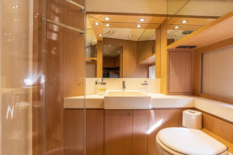 Slide: The Image of Luxurious bathroom interior of 2012 Riva 75 Venere yacht with modern fixtures and wooden finishes. - 33