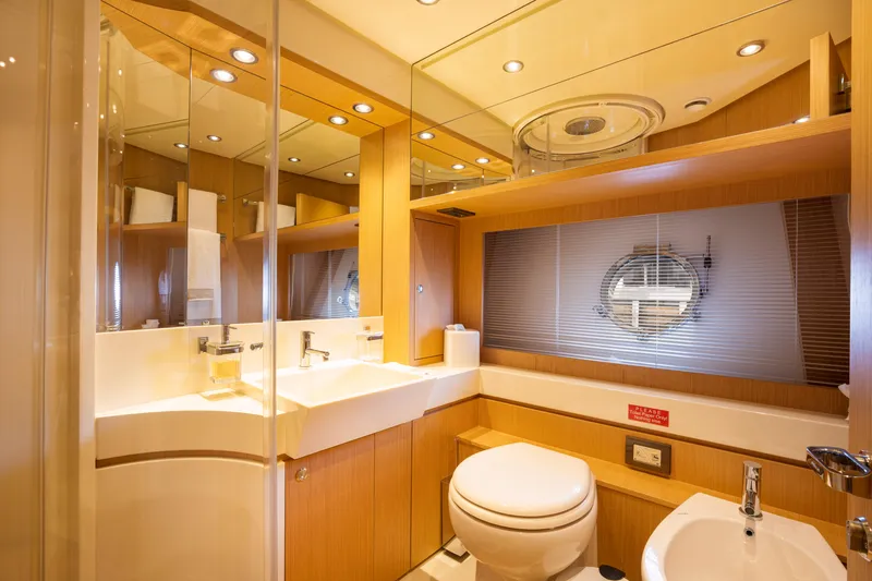 Slide: The Image of Luxurious bathroom on a 2012 Riva 75 Venere yacht with modern fixtures. - 35