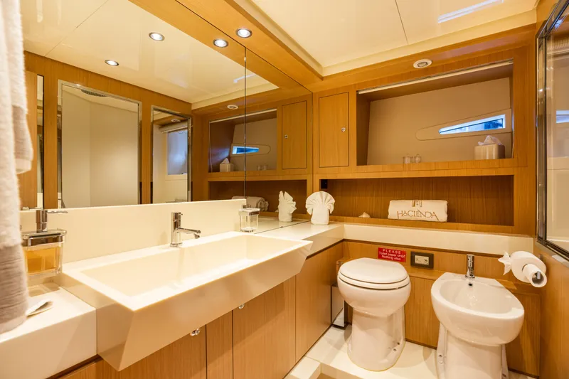 Slide: The Image of Luxurious bathroom in 2012 Riva 75 Venere yacht with modern fixtures and wooden cabinetry. - 39