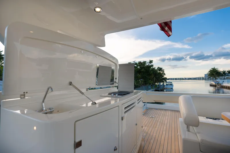 Slide: The Image of Outdoor kitchen on a 2012 Riva 75 Venere yacht with scenic waterfront view. - 44