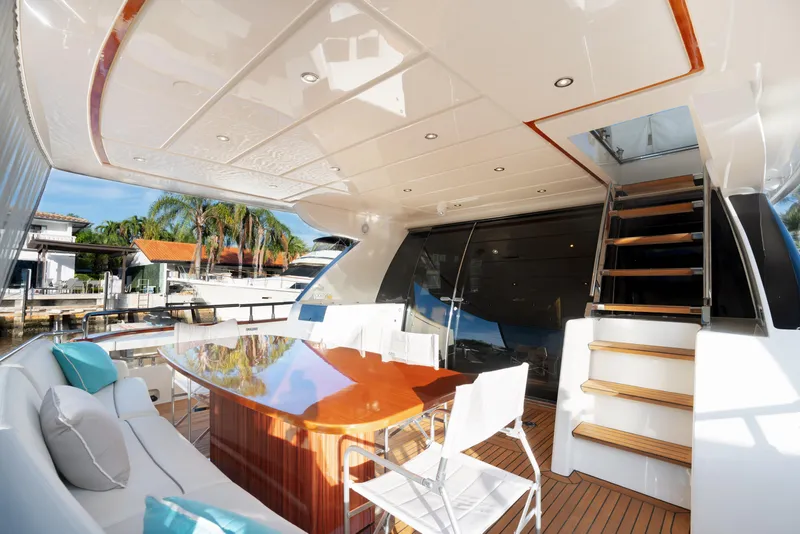 Slide: The Image of Luxurious 2012 Riva 75 Venere yacht deck with elegant seating and dining area. - 48
