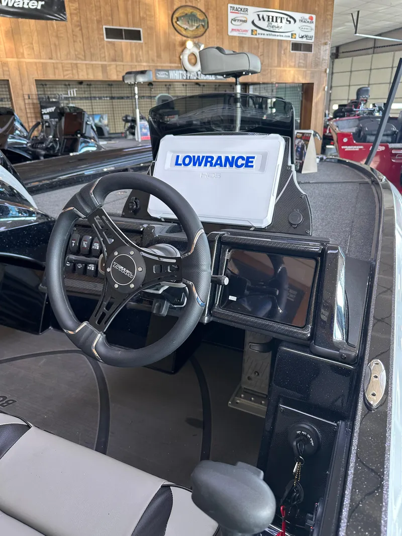Slide: The Image of 2024 Triton 20XP Patriot boat interior with Lowrance navigation system. - 14