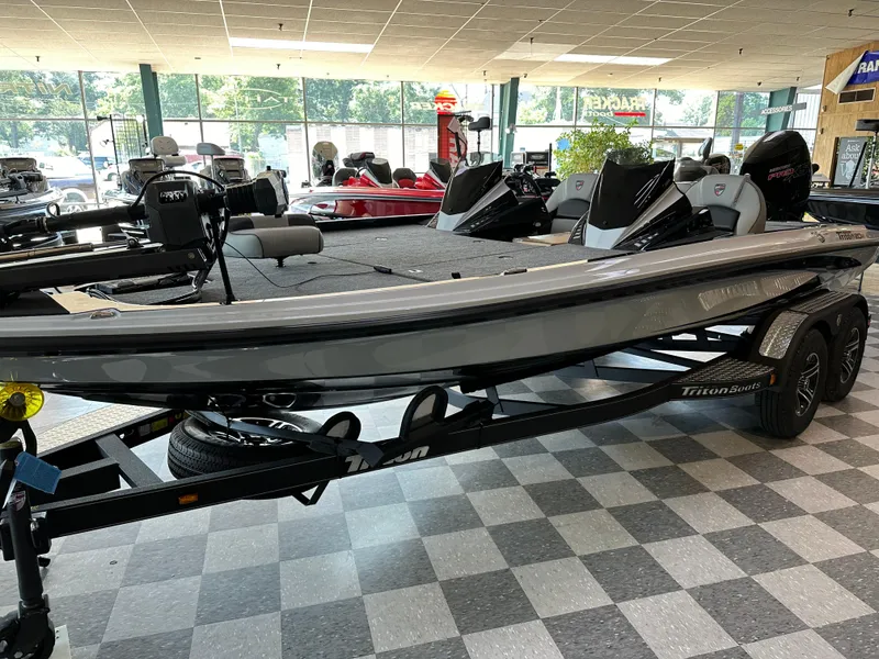 Slide: The Image of 2024 Triton 20XP Patriot boat on display in showroom. - 2