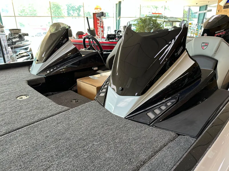 Slide: The Image of 2024 Triton 20XP Patriot boat interior with dual consoles and sleek design. - 4