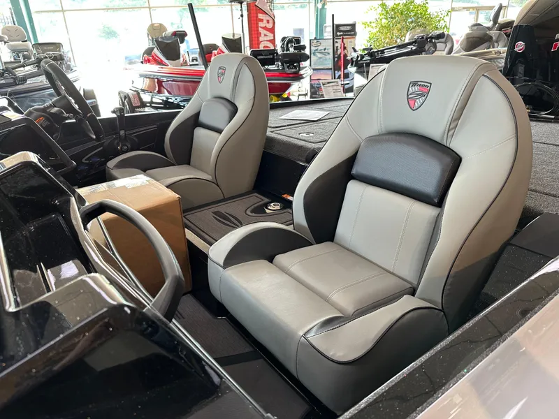 Slide: The Image of 2024 Triton 20XP Patriot boat interior with premium seating. - 5