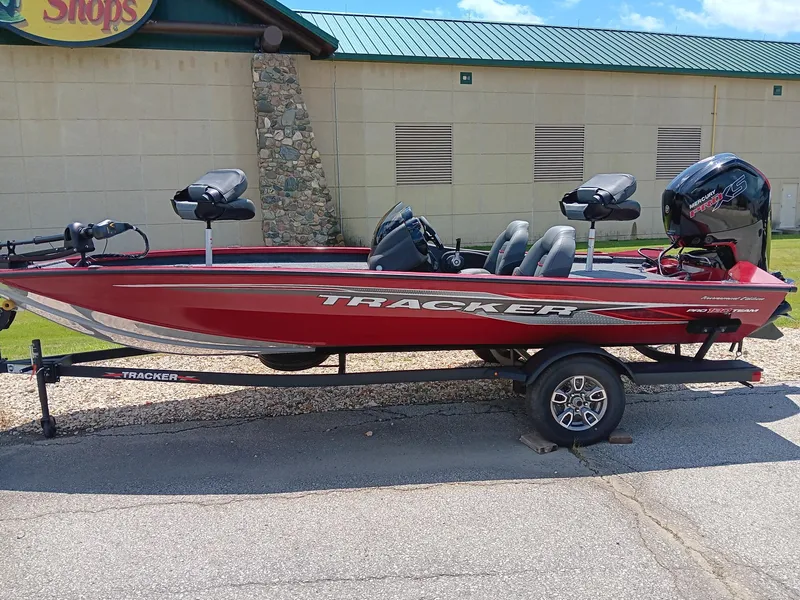 The Image of 2024 Tracker Pro Team 190 TX fishing boat on trailer, red color. - 0