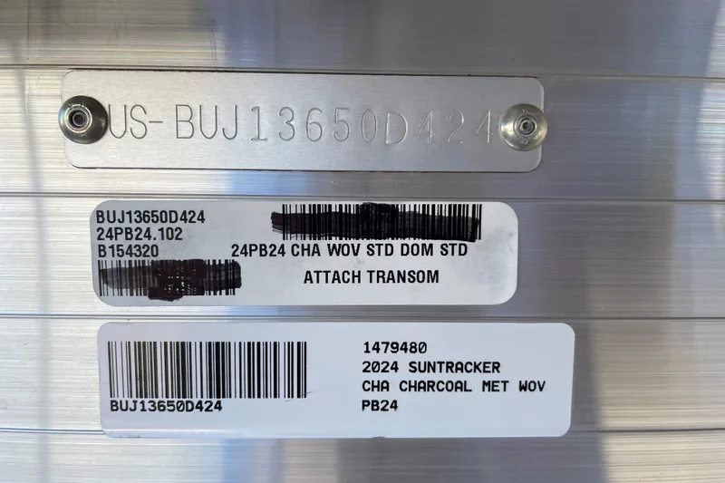 Slide: The Image of 2024 Sun Tracker Party Barge 24 DLX identification plates with serial numbers and barcodes. - 59