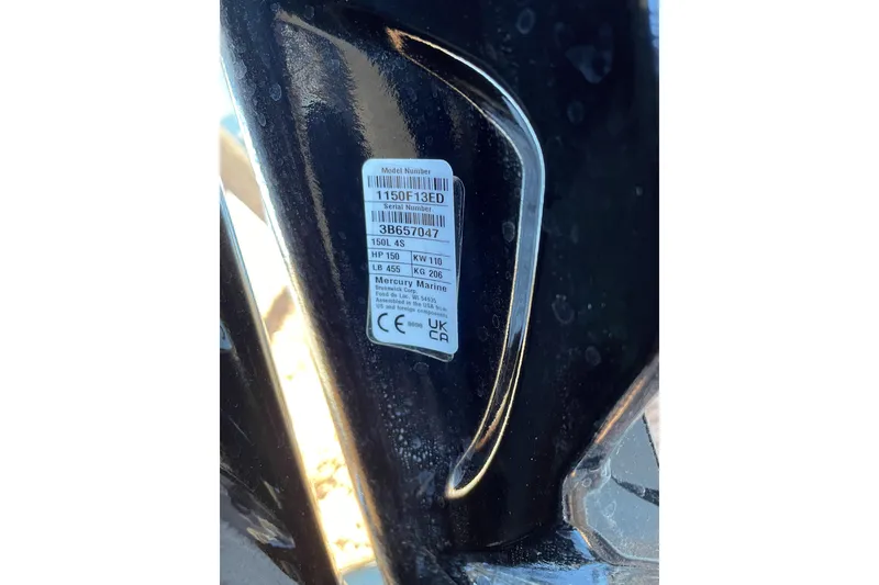 Slide: The Image of Label on a 2024 Sun Tracker Party Barge 24 DLX, displaying model and serial numbers. - 60