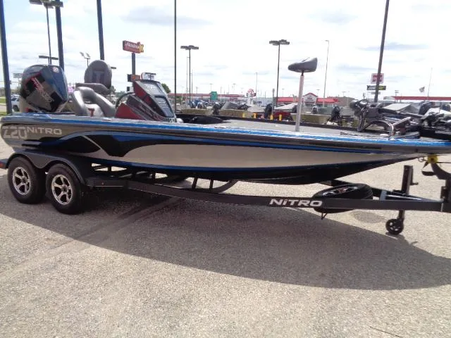 Slide: The Image of 2024 Nitro Z20 Pro fishing boat on trailer in parking lot. - 3