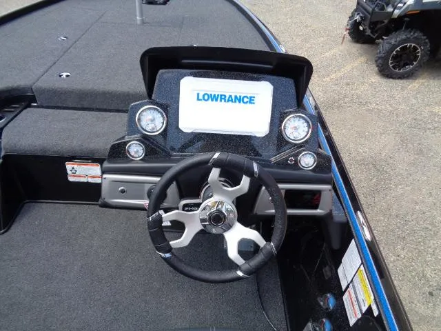 Slide: The Image of 2024 Nitro Z20 Pro boat dashboard with Lowrance display and steering wheel. - 7