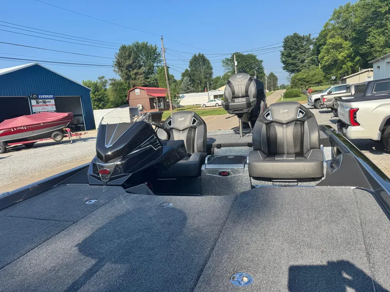 Slide: The Image of 2024 Ranger Z521R Ranger Cup Equipped boat with dual seats and motor in a dealership lot. - 8