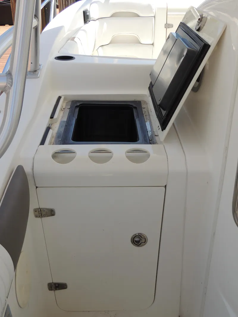 Slide: The Image of 2006 Boston Whaler 320 Outrage Cuddy Cabin with open storage compartment. - 16