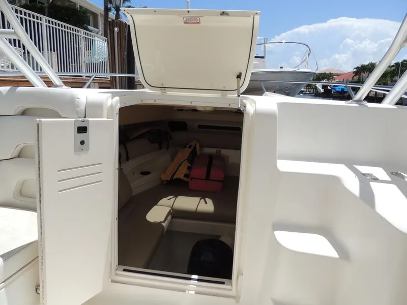 Slide: The Image of 2006 Boston Whaler 320 Outrage Cuddy Cabin interior view with open hatch. - 19