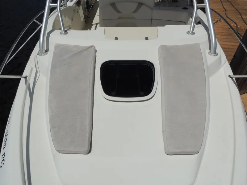Slide: The Image of 2006 Boston Whaler 320 Outrage Cuddy Cabin deck with cushions and hatch. - 21
