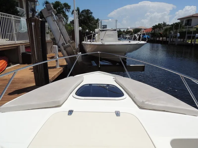 Slide: The Image of 2006 Boston Whaler 320 Outrage Cuddy Cabin docked at marina. - 23