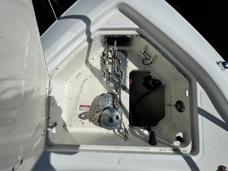 Slide: The Image of 2006 Boston Whaler 320 Outrage Cuddy Cabin anchor storage compartment. - 24