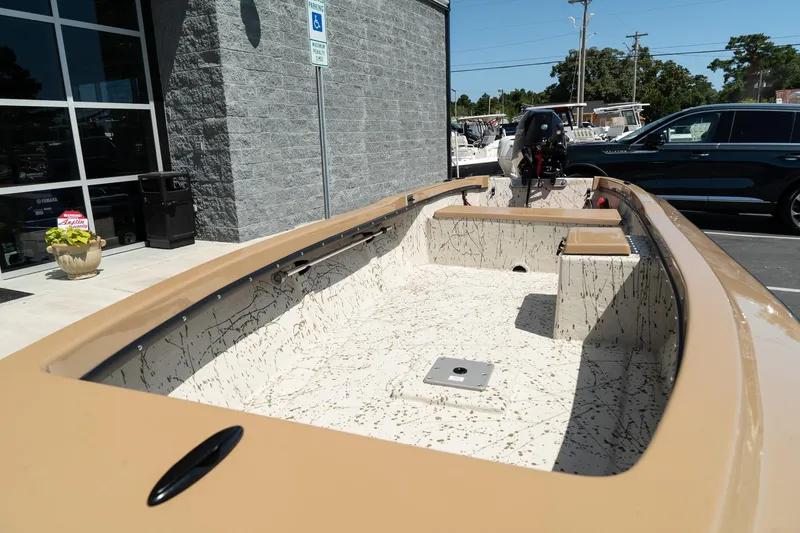 Slide: The Image of 2024 Mi Tide V1408 boat on display outside dealership. - 13