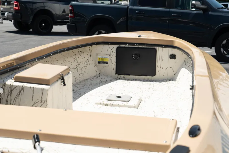 Slide: The Image of Mi Tide V1408 2024 boat interior with beige seating and storage compartments. - 6