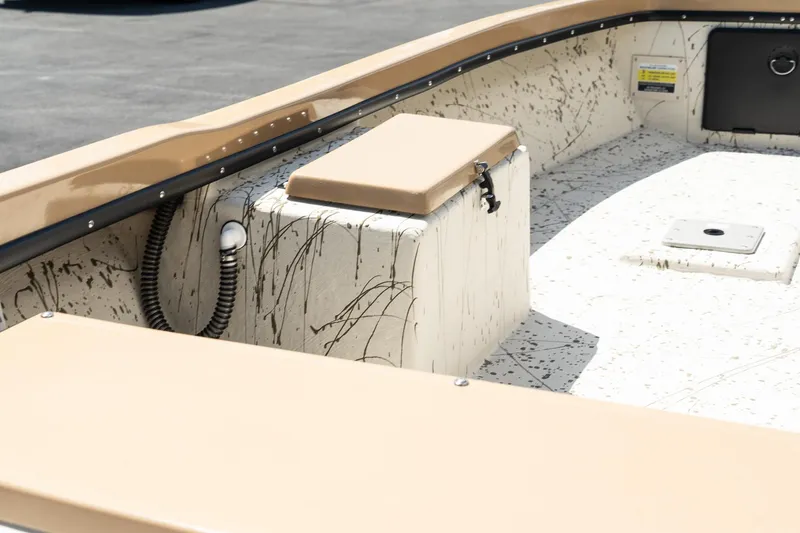 Slide: The Image of 2024 Mi Tide V1408 boat interior with beige seating and splatter design. - 8