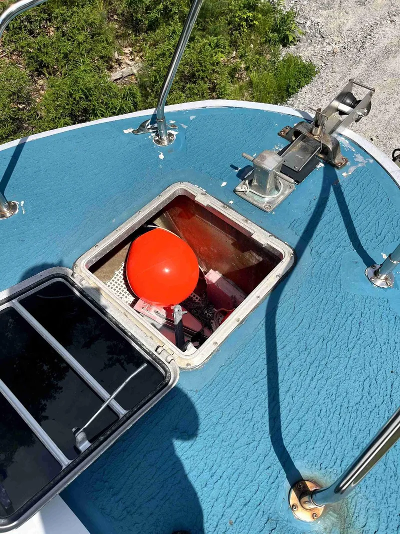 Slide: The Image of Top view of a 1990 MTI 26-Foot US NAVY Personnel Boat with an open hatch. - 13