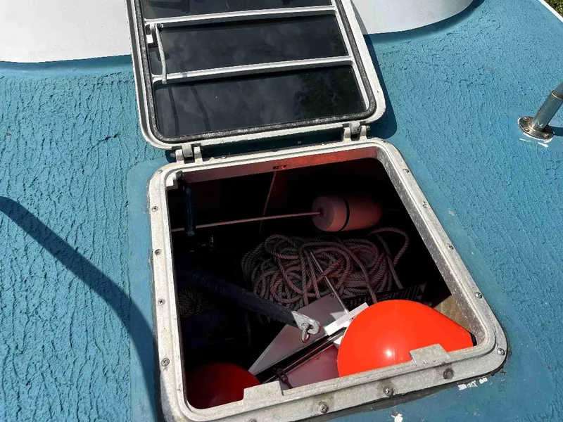 Slide: The Image of Open hatch of 1990 MTI 26-Foot US NAVY Personnel Boat showing storage compartment. - 14