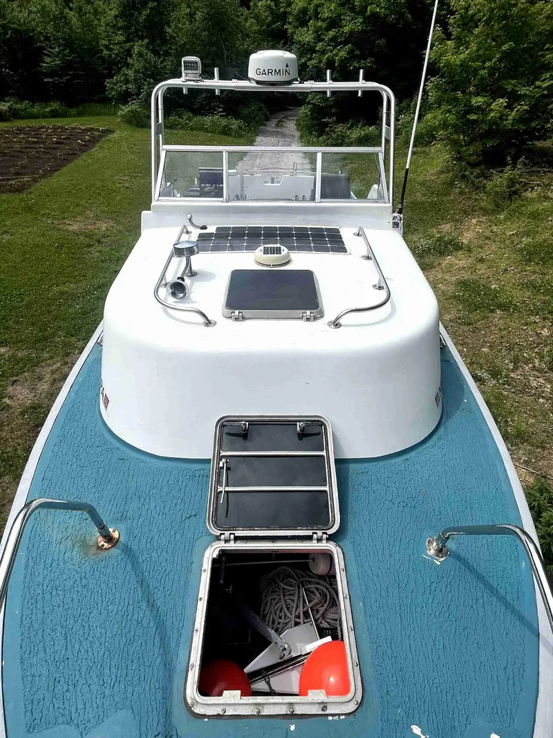 Slide: The Image of 1990 MTI 26-Foot US NAVY Personnel Boat with open hatches and Garmin equipment. - 15