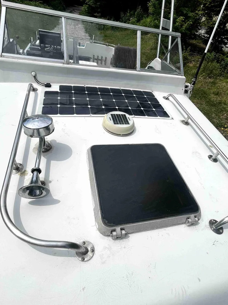 Slide: The Image of 1990 MTI 26-Foot US NAVY Personnel Boat deck with solar panel and hatch. - 16