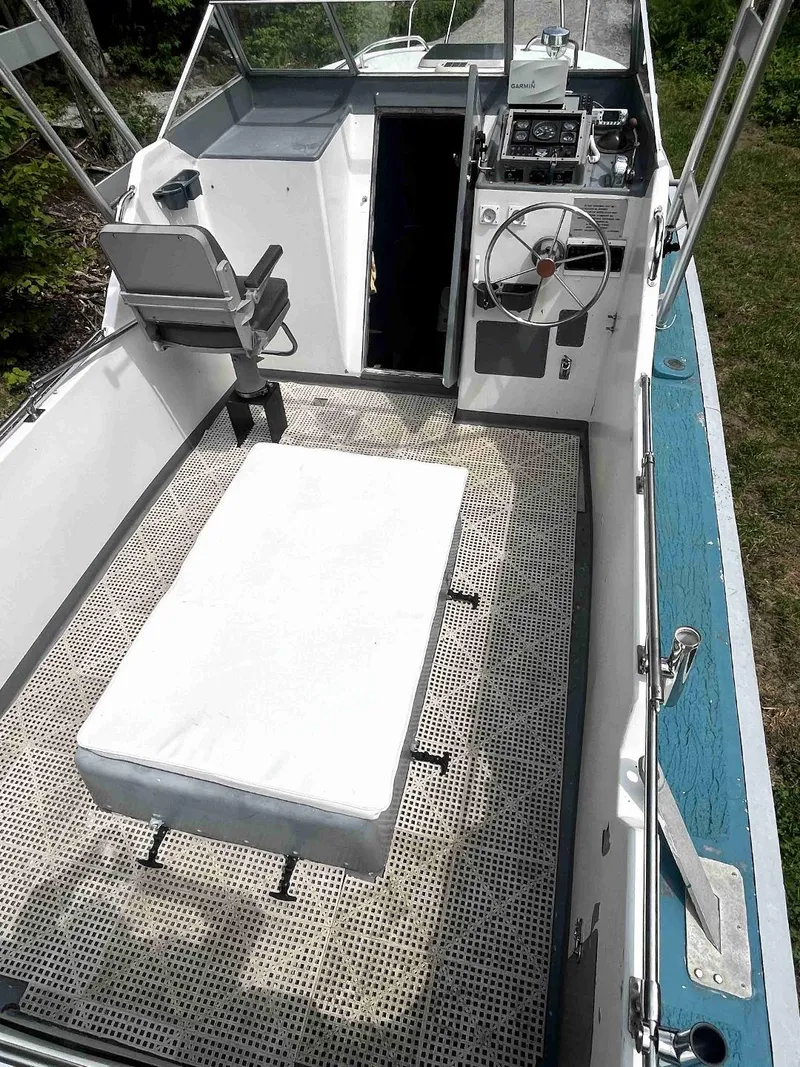 Slide: The Image of 1990 MTI 26-Foot US NAVY Personnel Boat interior with seating and control area. - 18