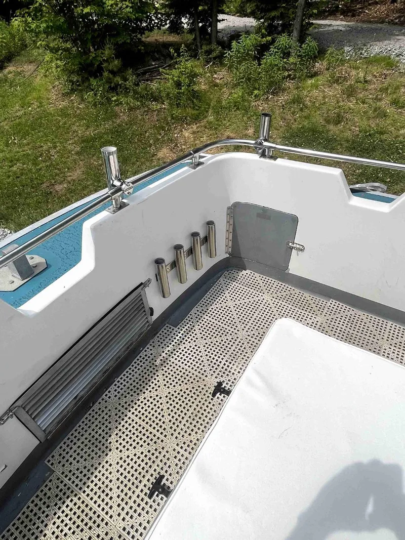 Slide: The Image of 1990 MTI 26-Foot US NAVY Personnel Boat interior with rod holders and seating. - 19